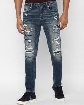 heavy-wash skinny fit distressed jeans