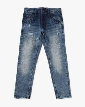 heavy-wash distressed jeans