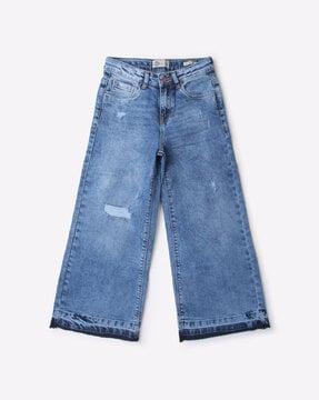 heavy-wash flared distressed jeans