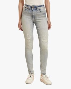 heavy-wash skinny fit distressed jeans