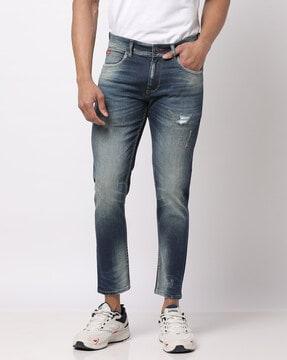 heavy-wash slim fit distressed jeans