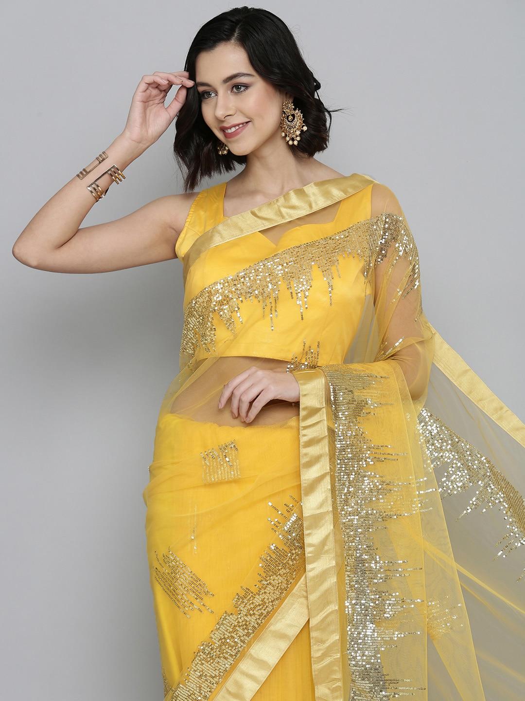 here&now yellow & golden sequinned net saree