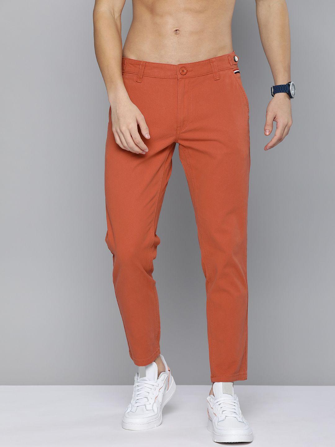 here&now men rust red solid mid rise chinos