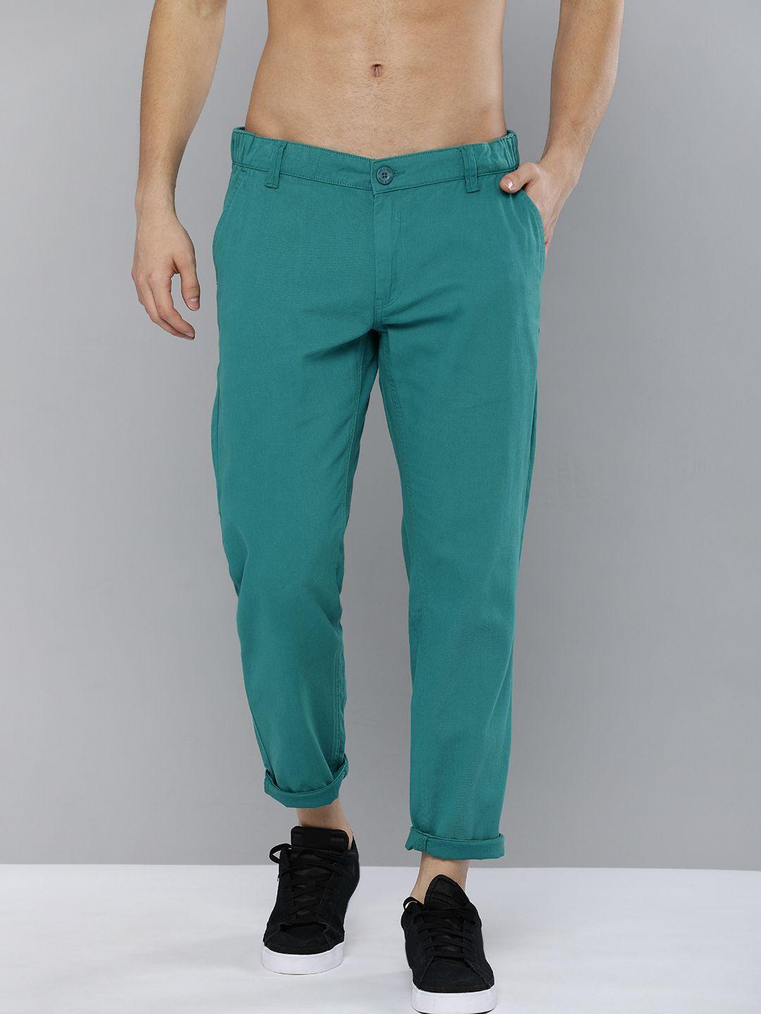 here&now men teal green slim fit solid regular trousers