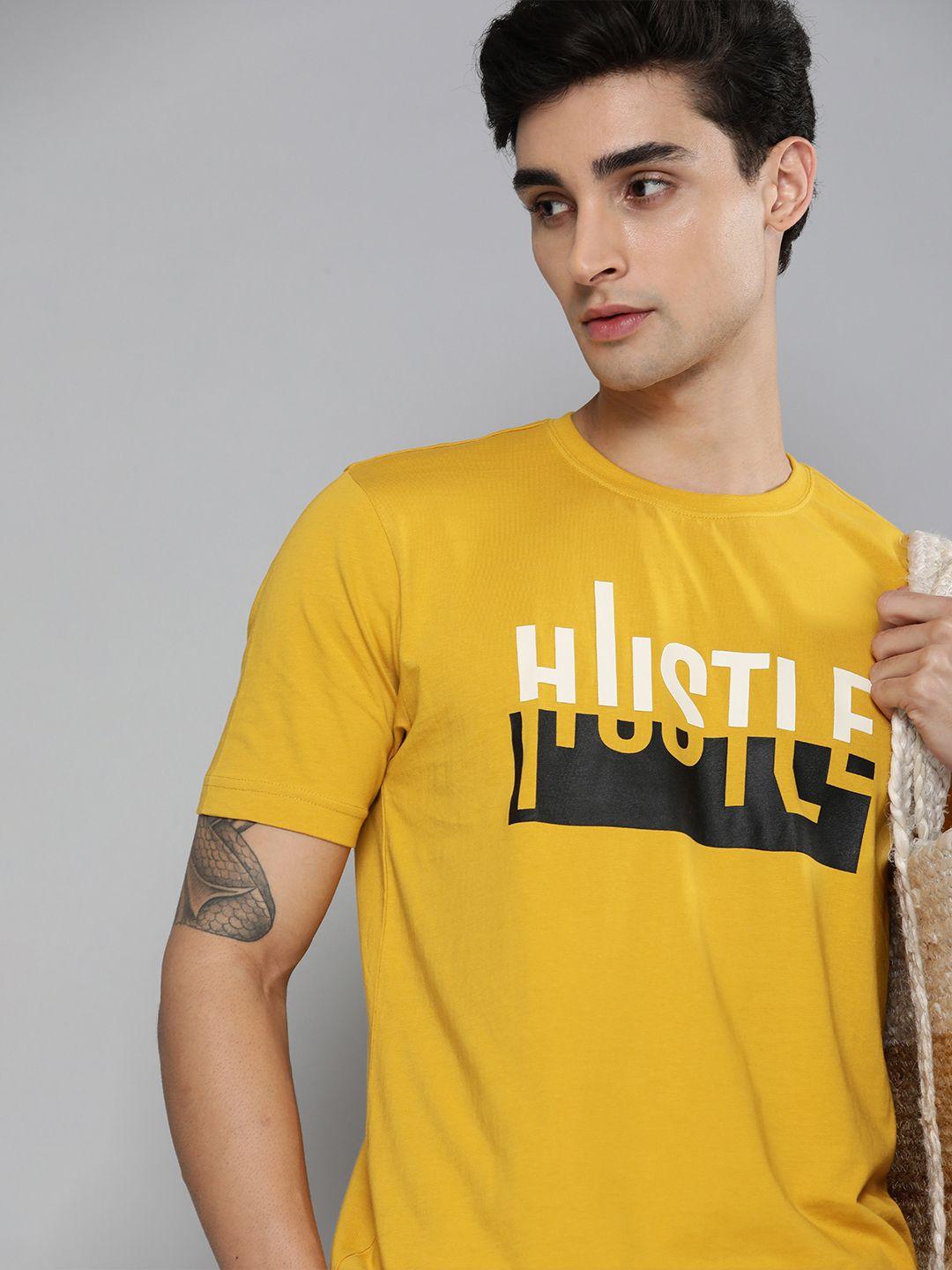 here&now men yellow & white typography printed pure cotton t-shirt