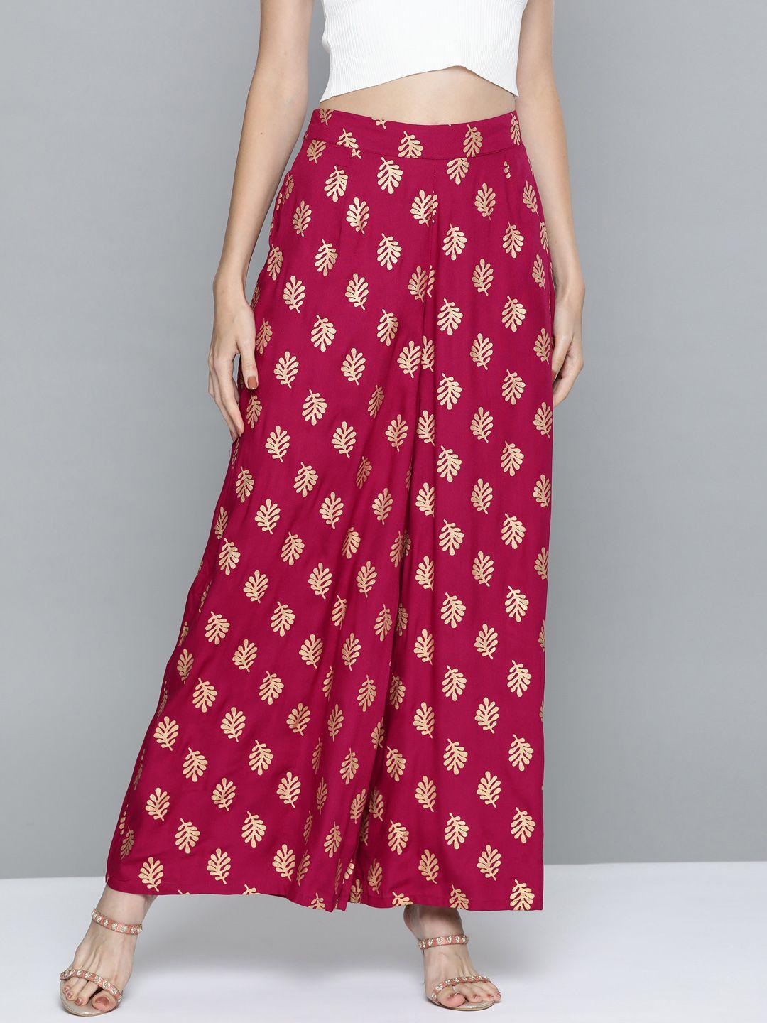 here&now women magenta & golden ethnic motifs printed palazzos