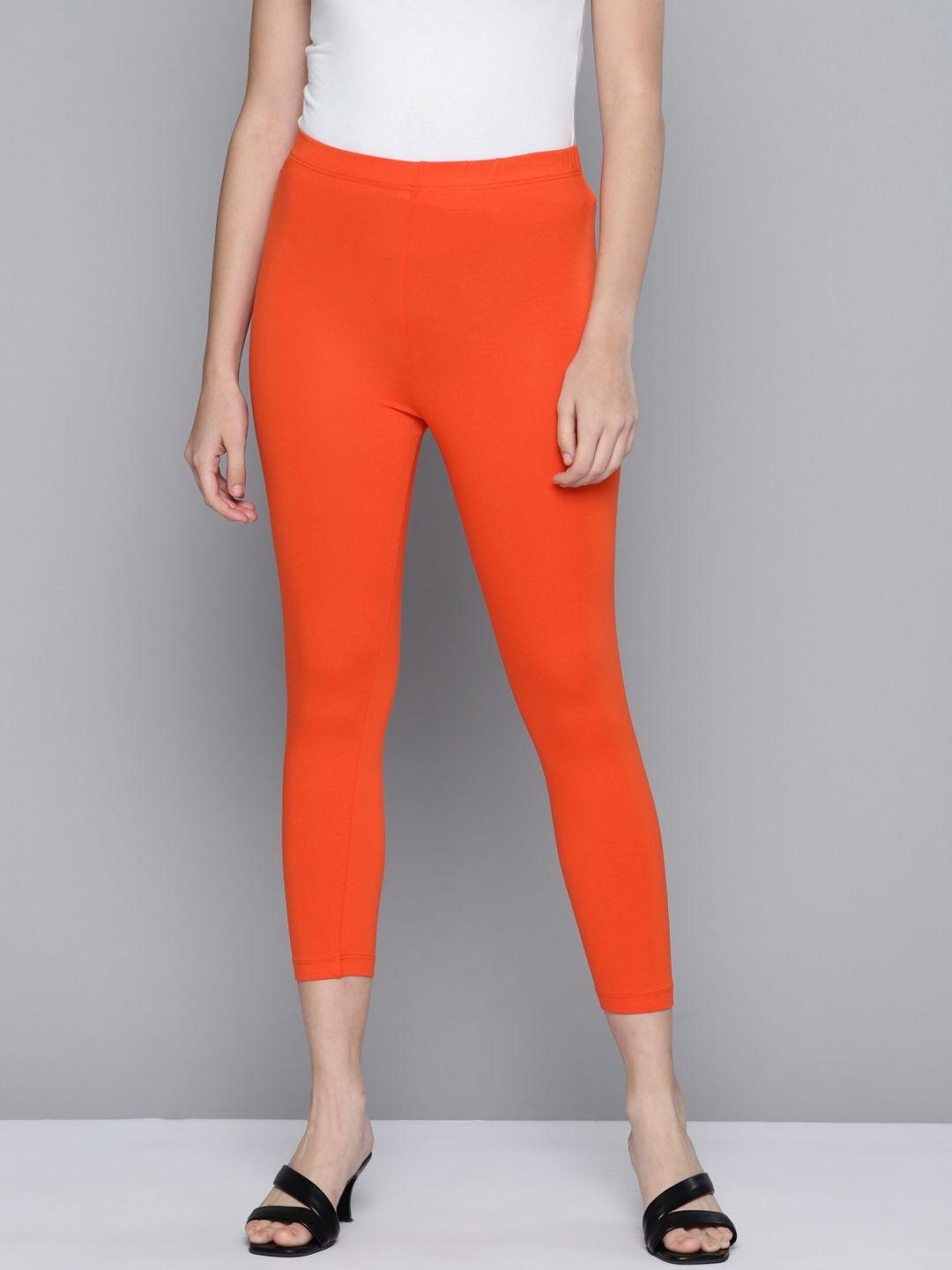 here&now women orange solid three-fourth length leggings