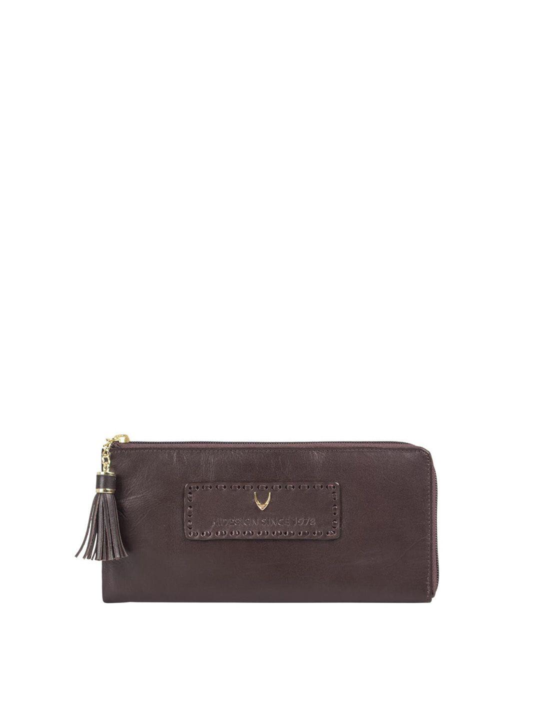 hidesign brown purse clutch with tassel