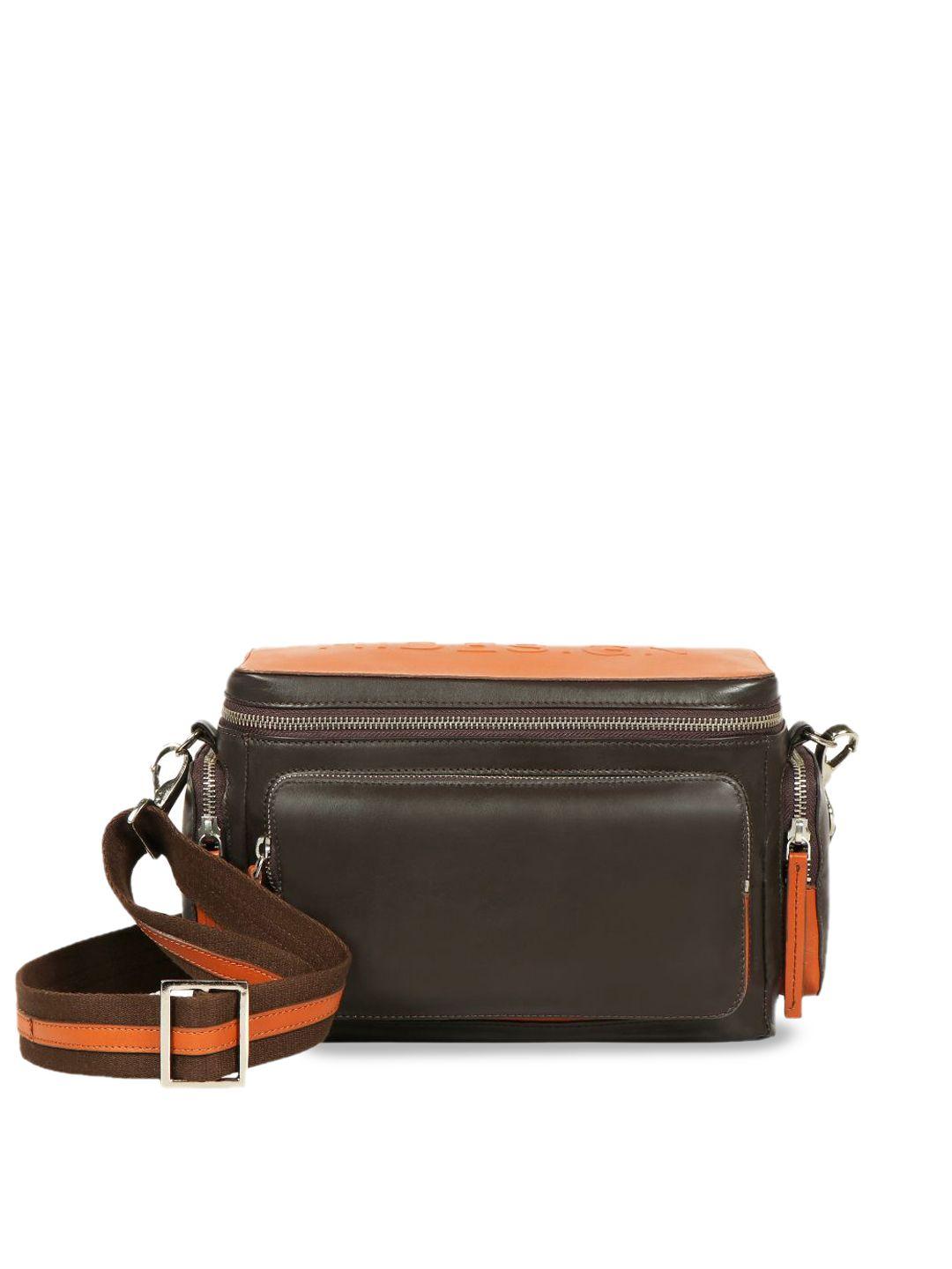 hidesign brown leather structured sling bag with cut work