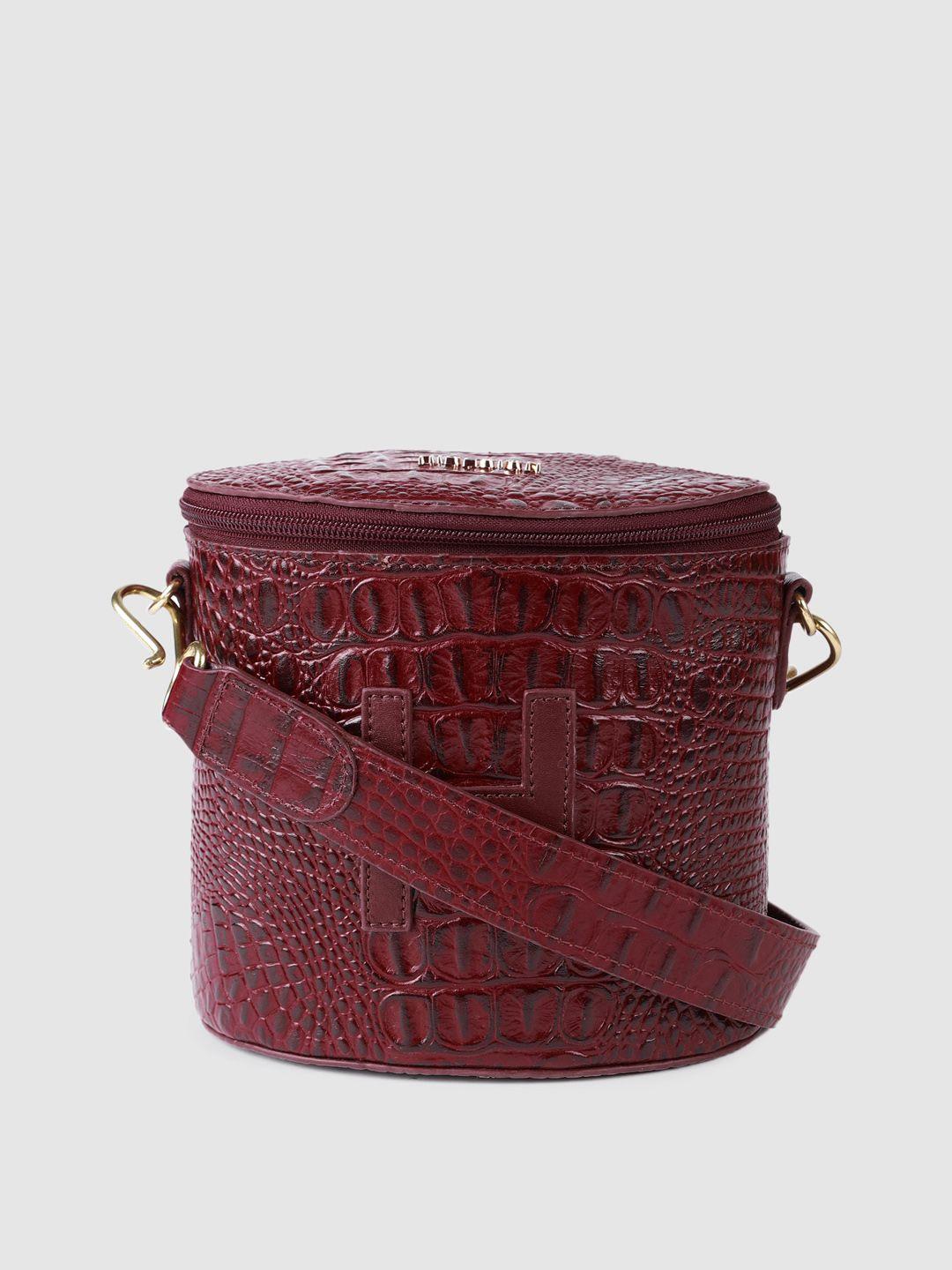 hidesign maroon animal textured leather bucket sling bag