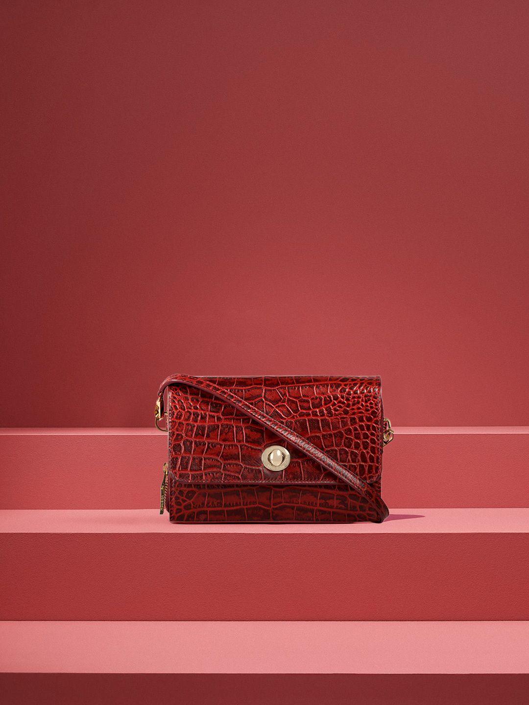 hidesign red textured leather sling bag