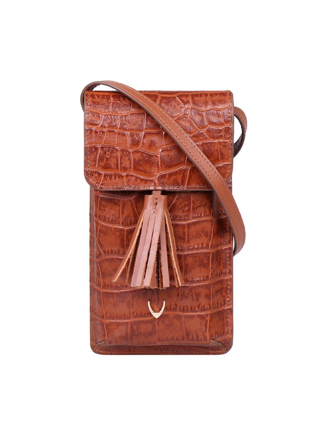hidesign women tan animal textured leather envelope with sling strap