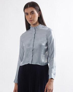 high-neck top with ruffled detail