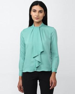 high-neck top with ruffled overlay