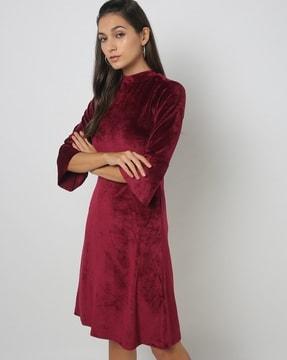 high-neck a-line dress with bell sleeves