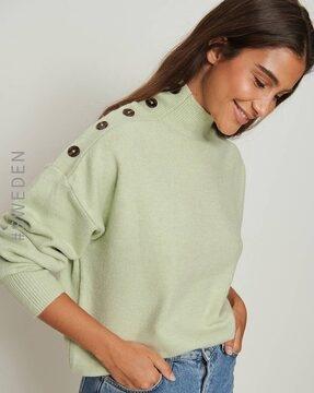high-neck pullover with button accents
