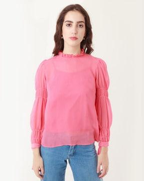 high-neck top with cuffed sleeves