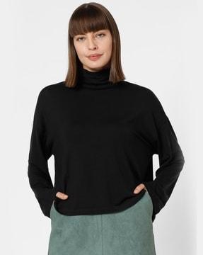 high-neck top with dolman sleeves