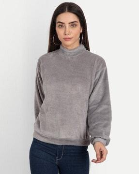 high-neck top with puff sleeves