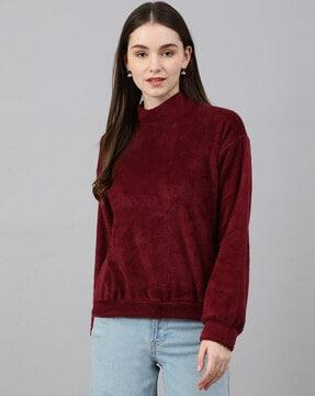 high-neck top with puff sleeves