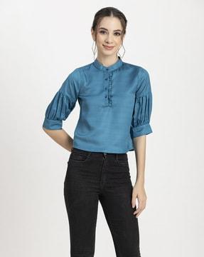 high-neck top with puff sleeves