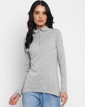 high-neck top with raglan sleeves