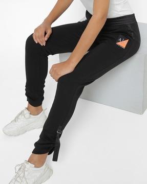 high-rise joggers with detailed cuffs