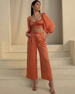high-rise pleat-front trousers