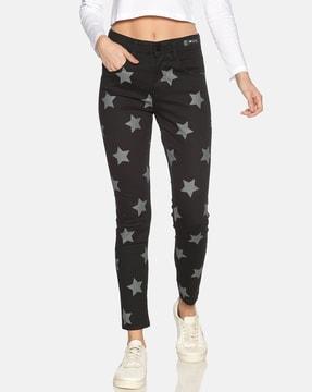 high-rise star print slim fit jeans