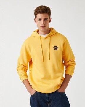 hoodie with placement-embroidered badge