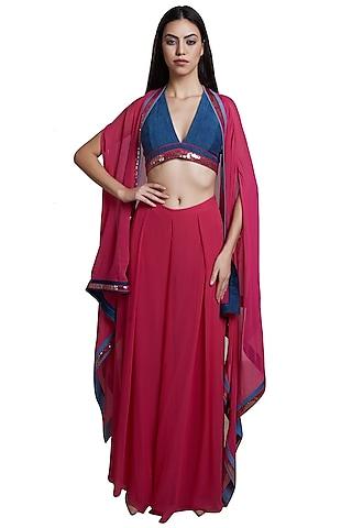 hot pink palazzo pants with blue blouse & cape