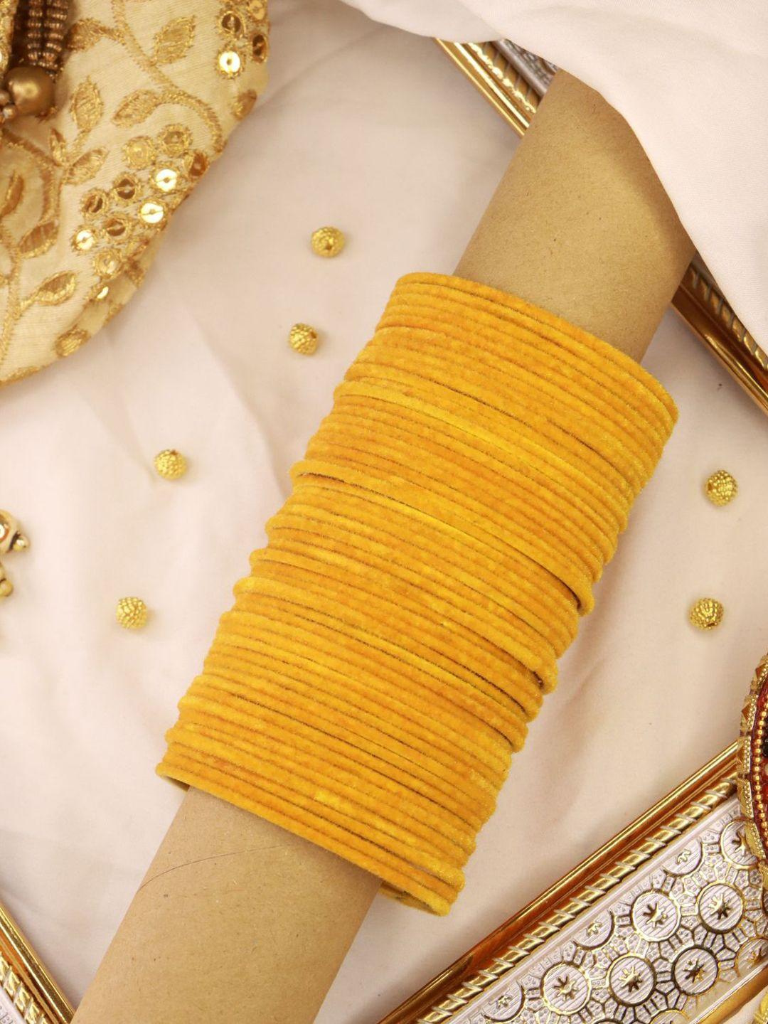 i jewels women set of 48 yellow solid metal velvet bangles