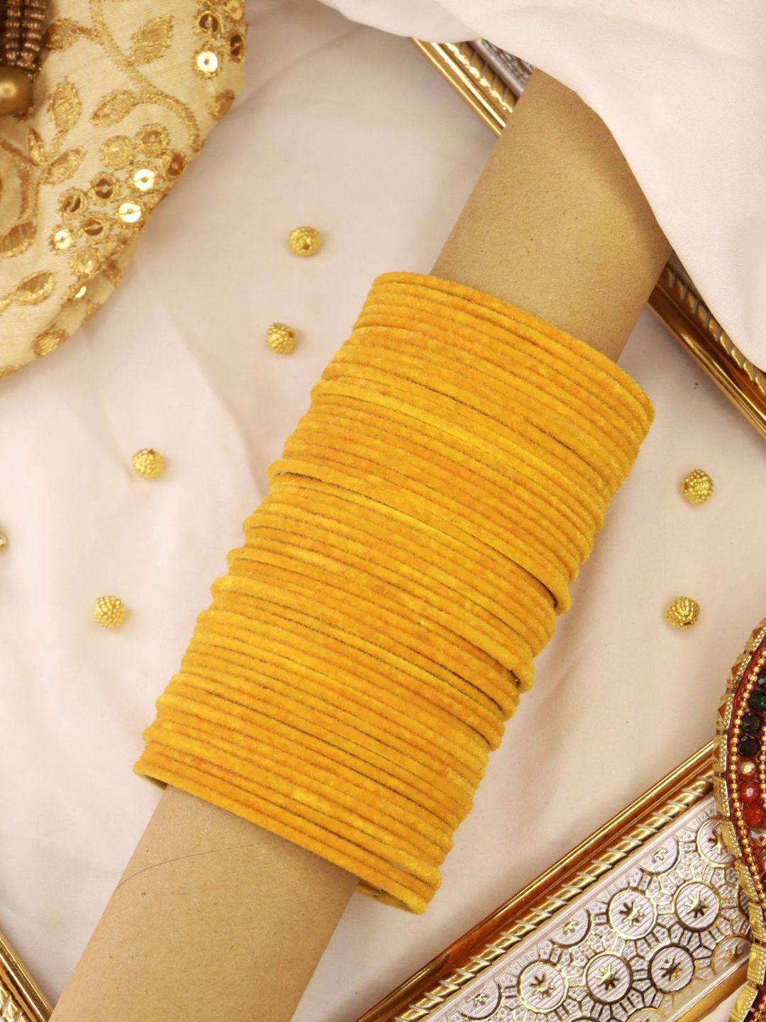i jewels women set of 48 yellow solid metal velvet bangles