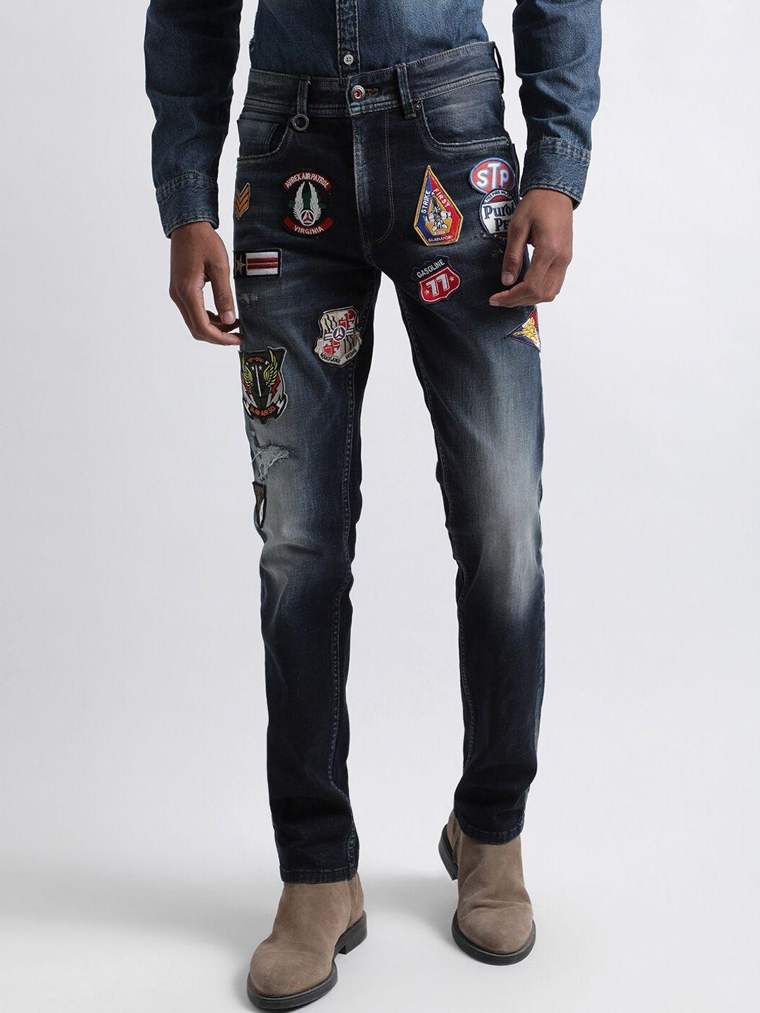 iconic men slim fit mildly distressed applique detail light fade jeans