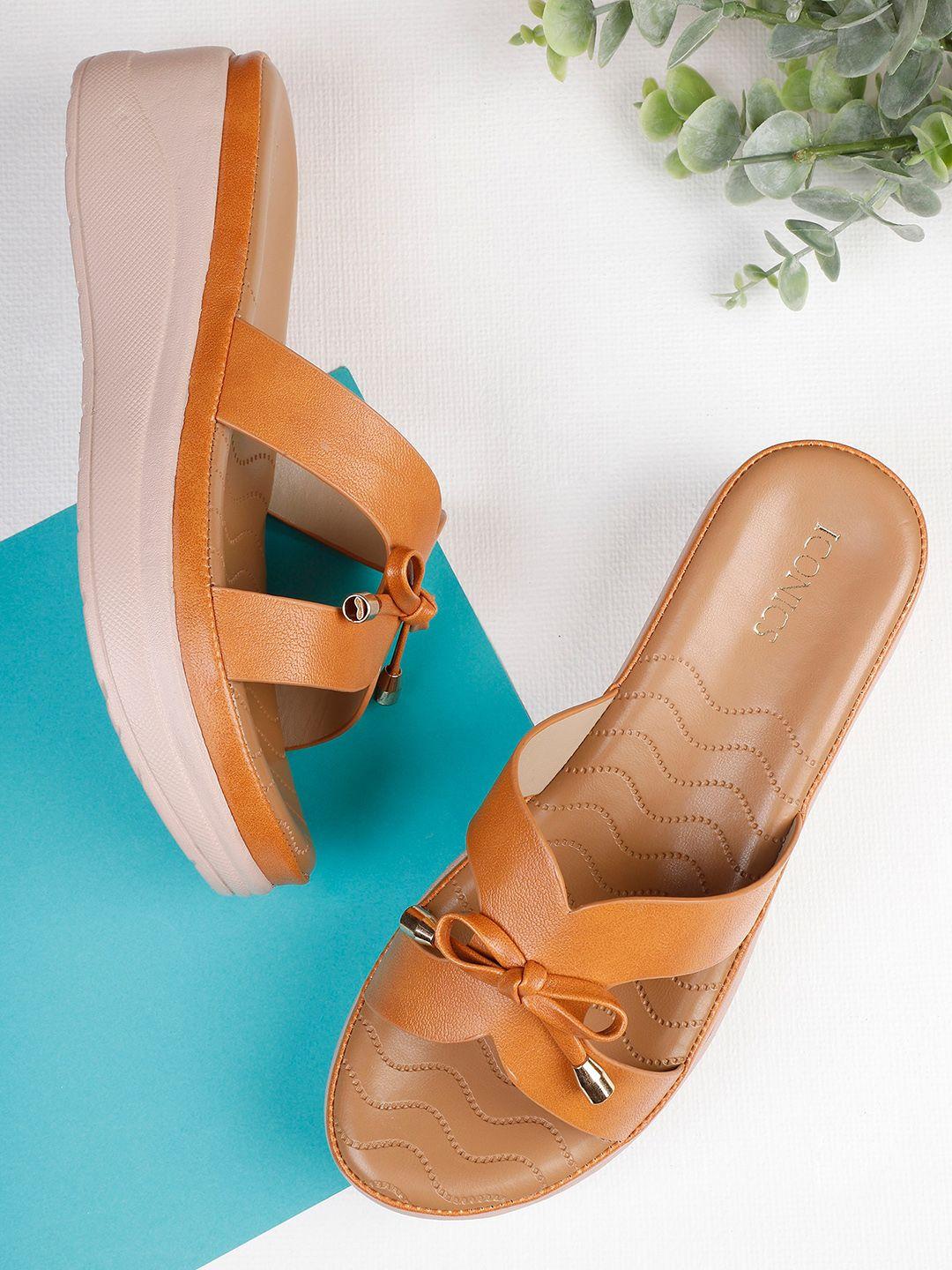 iconics tan pumps with bows