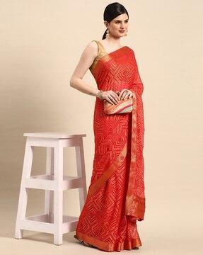 indian women red brasso foil with swarovski work solid saree