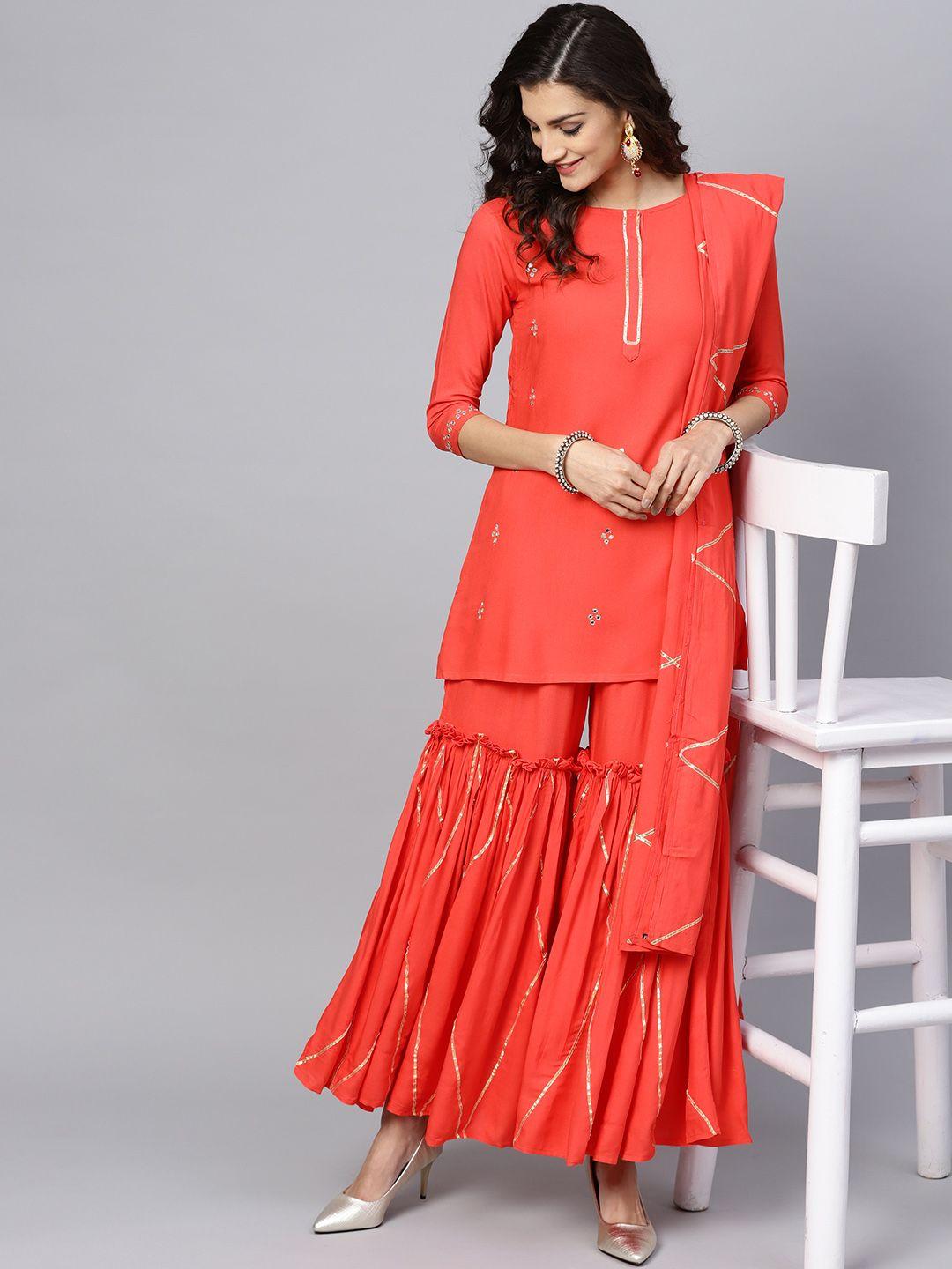 ishin women coral red solid kurta with sharara & dupatta