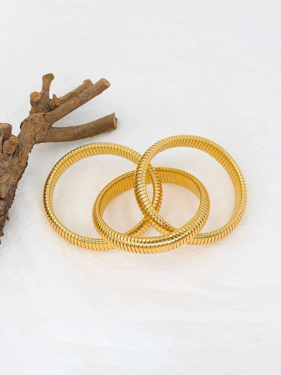 ishkaara women stack of 3 gold-plated coiled elasticated bracelet