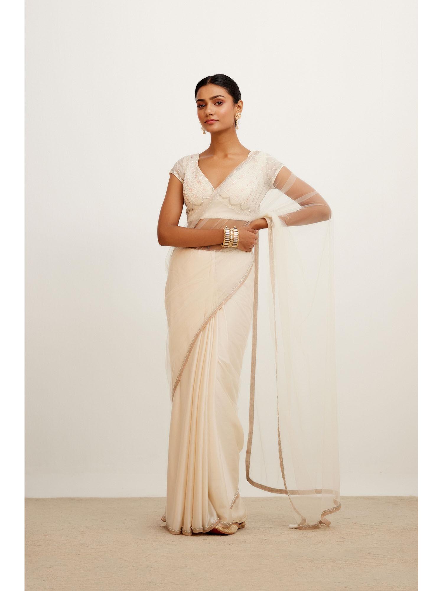 ivory embroidered net and satin saree with stitched blouse