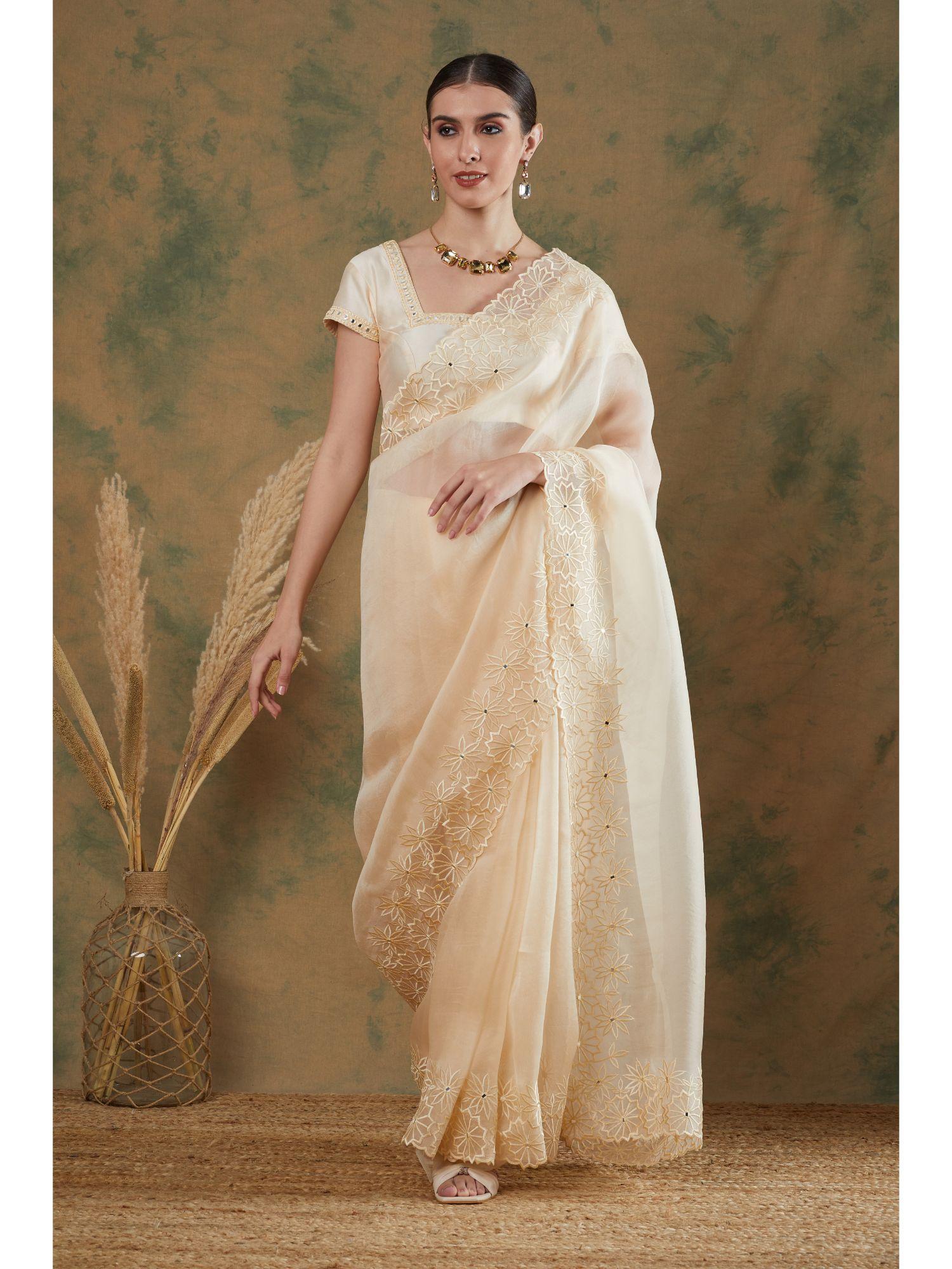 ivory embroidered saree with stitched blouse