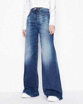 j47 wide legged mid-rise heavily-washed jeans