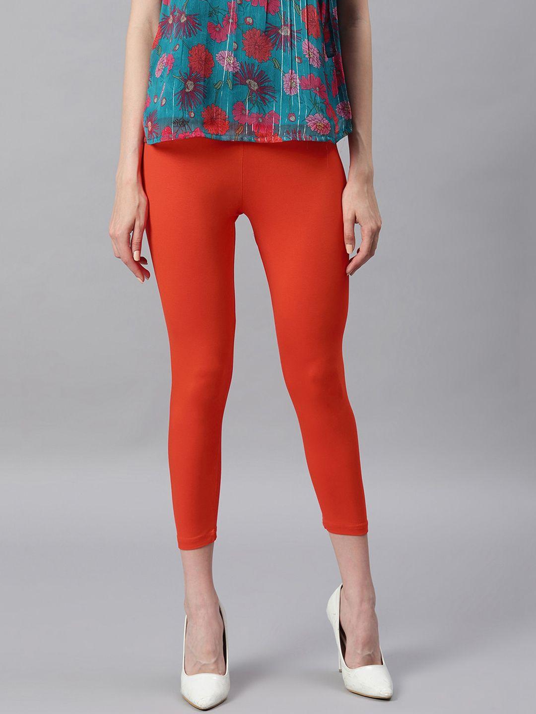 janasya women orange solid three-fourth length leggings