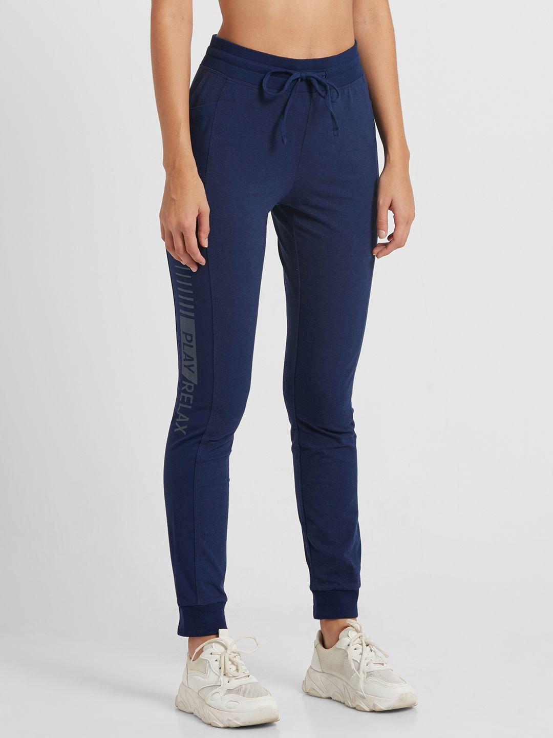 jockey athleisure women navy blue solid joggers with printed detail