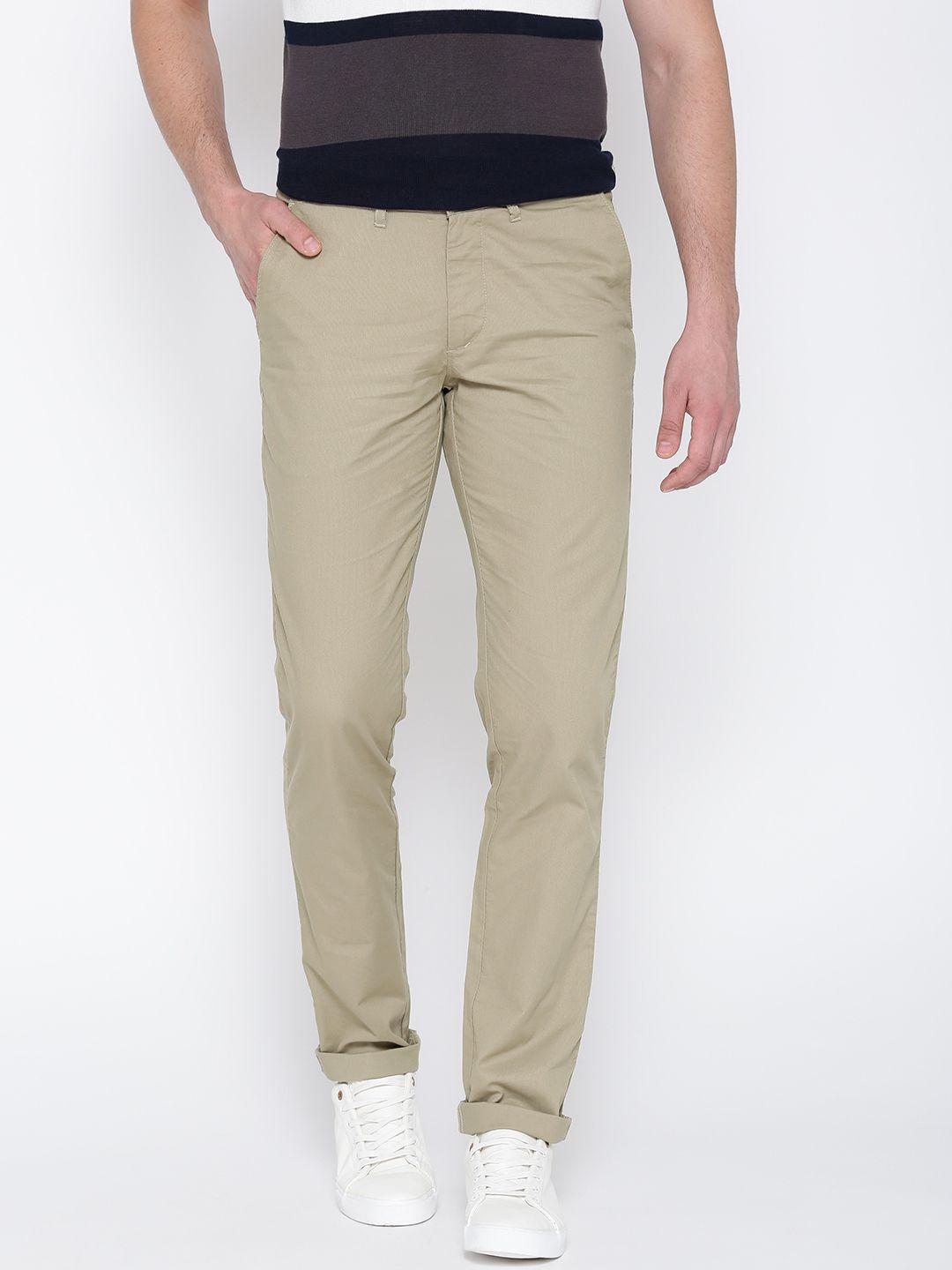 john players men beige slim fit solid casual trousers