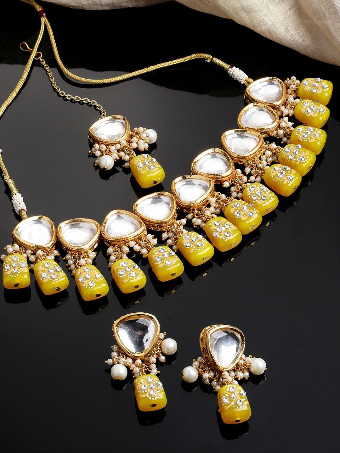 karatcart gold-plated light yellow tumble and polki kundan studded jewellery set