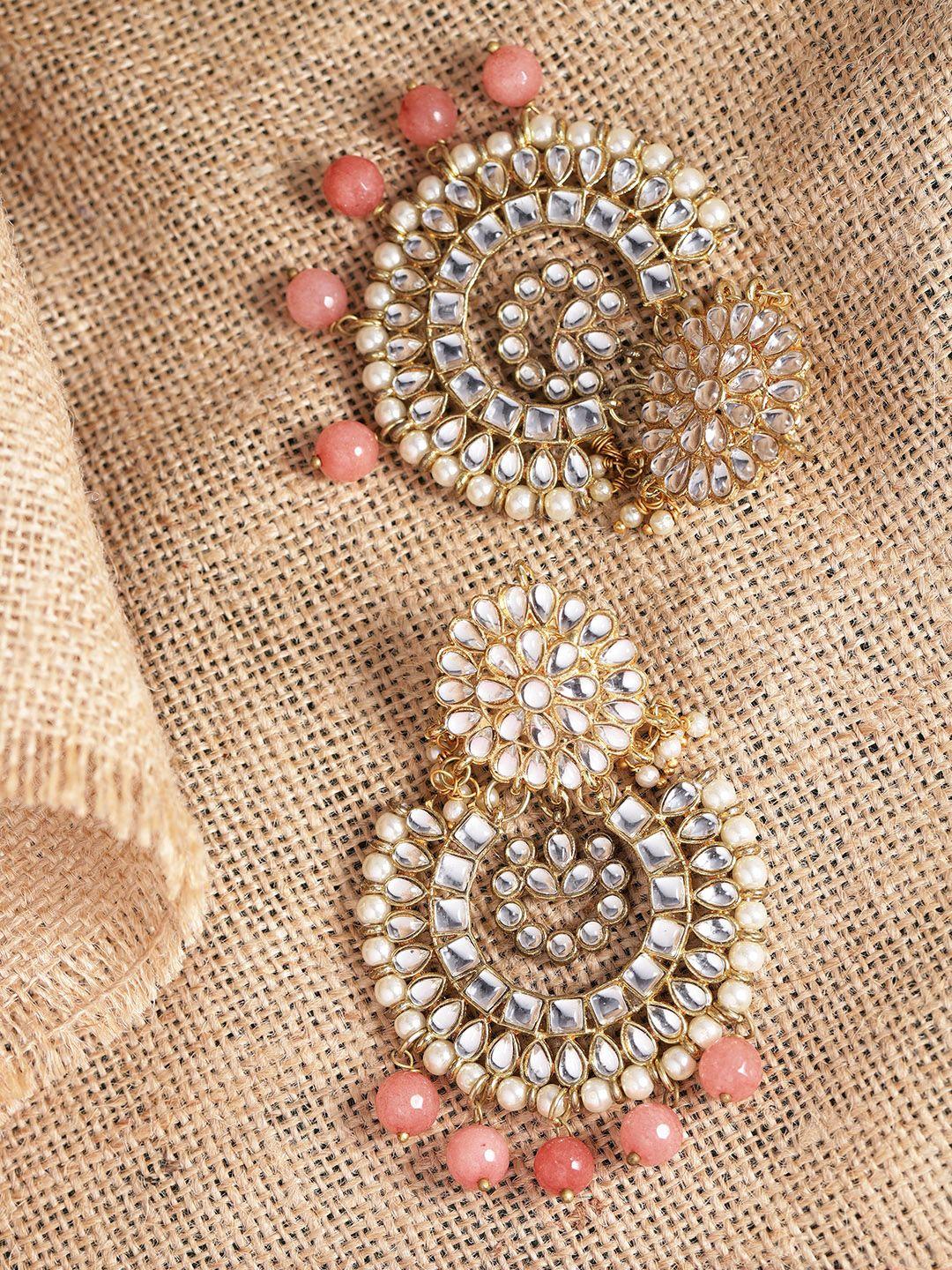 karatcart peach-coloured & off-white gold-plated stone-studded crescent shaped chandbalis