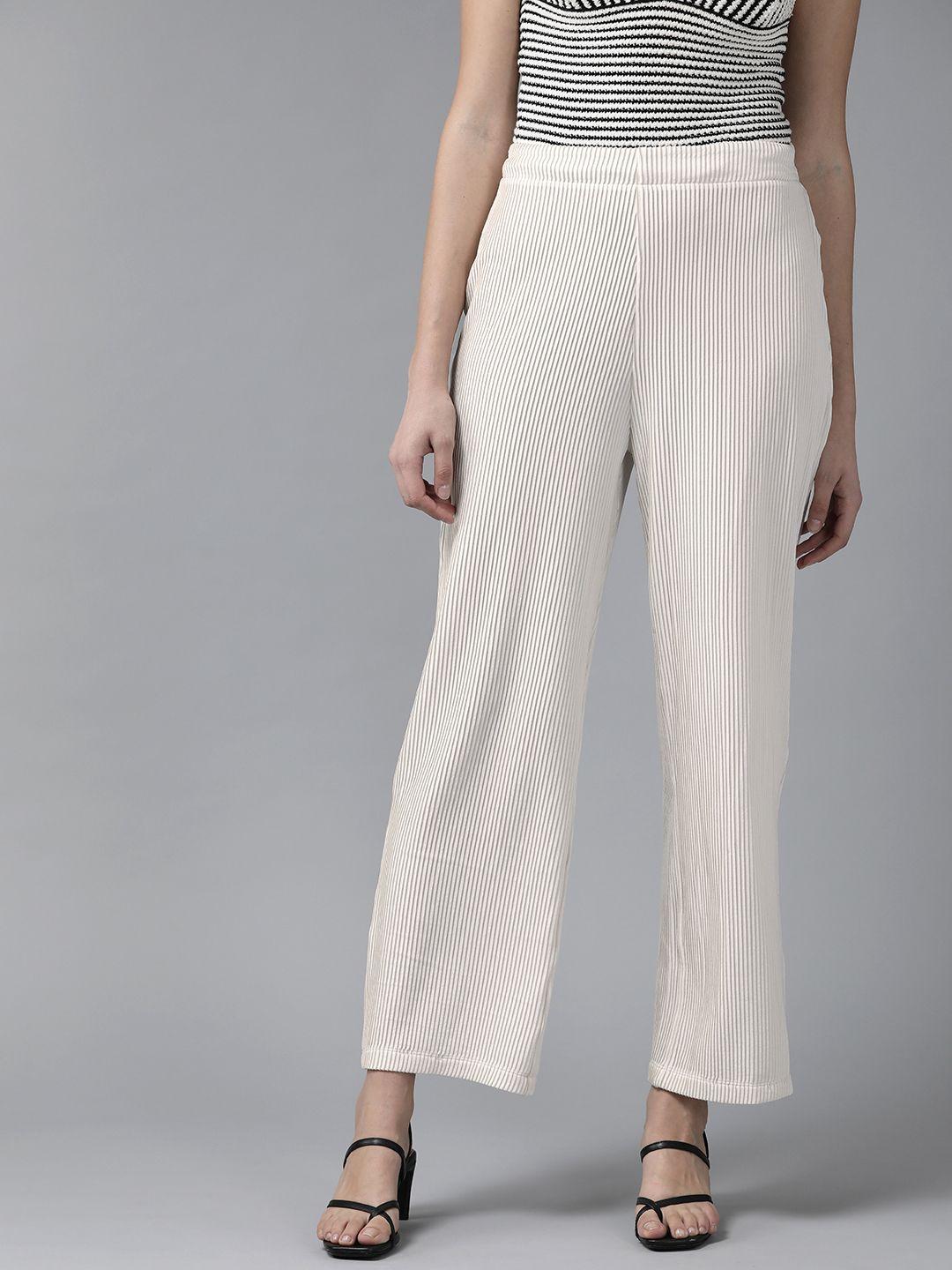 kassually women white solid flared mid-rise easy wash knitted flat-front parallel trousers