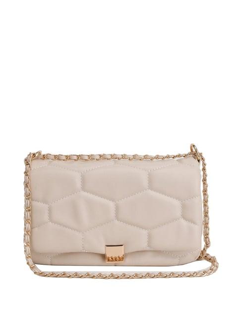 kazo beige synthetic quilted sling handbag