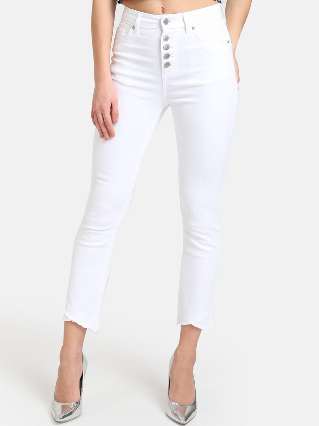 kazo women white regular fit mid-rise clean look jeans with cross fringe hem