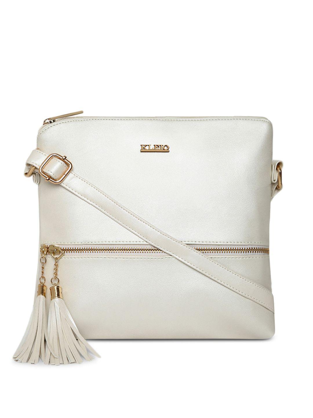 kleio off-white solid tasseled sling bag